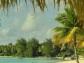 Couple walking on a beach, Bora Bora.